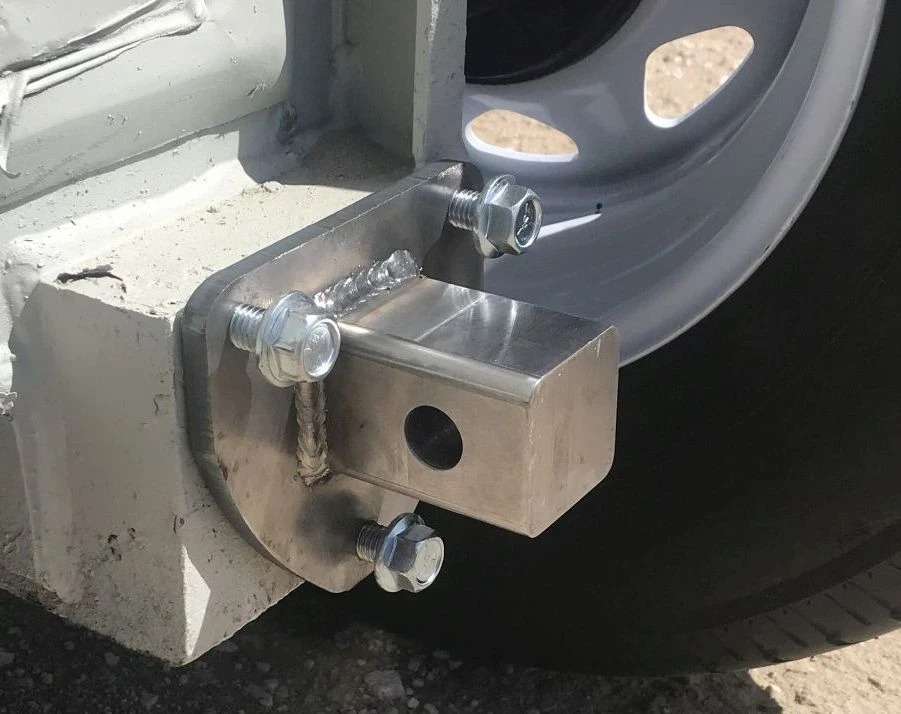 Truck wheel secured with anti-theft locking device.