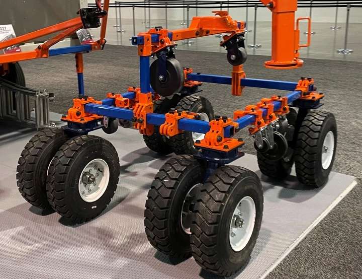 Orange and blue agricultural robot on display