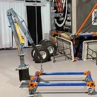 Industrial crane and equipment in warehouse.